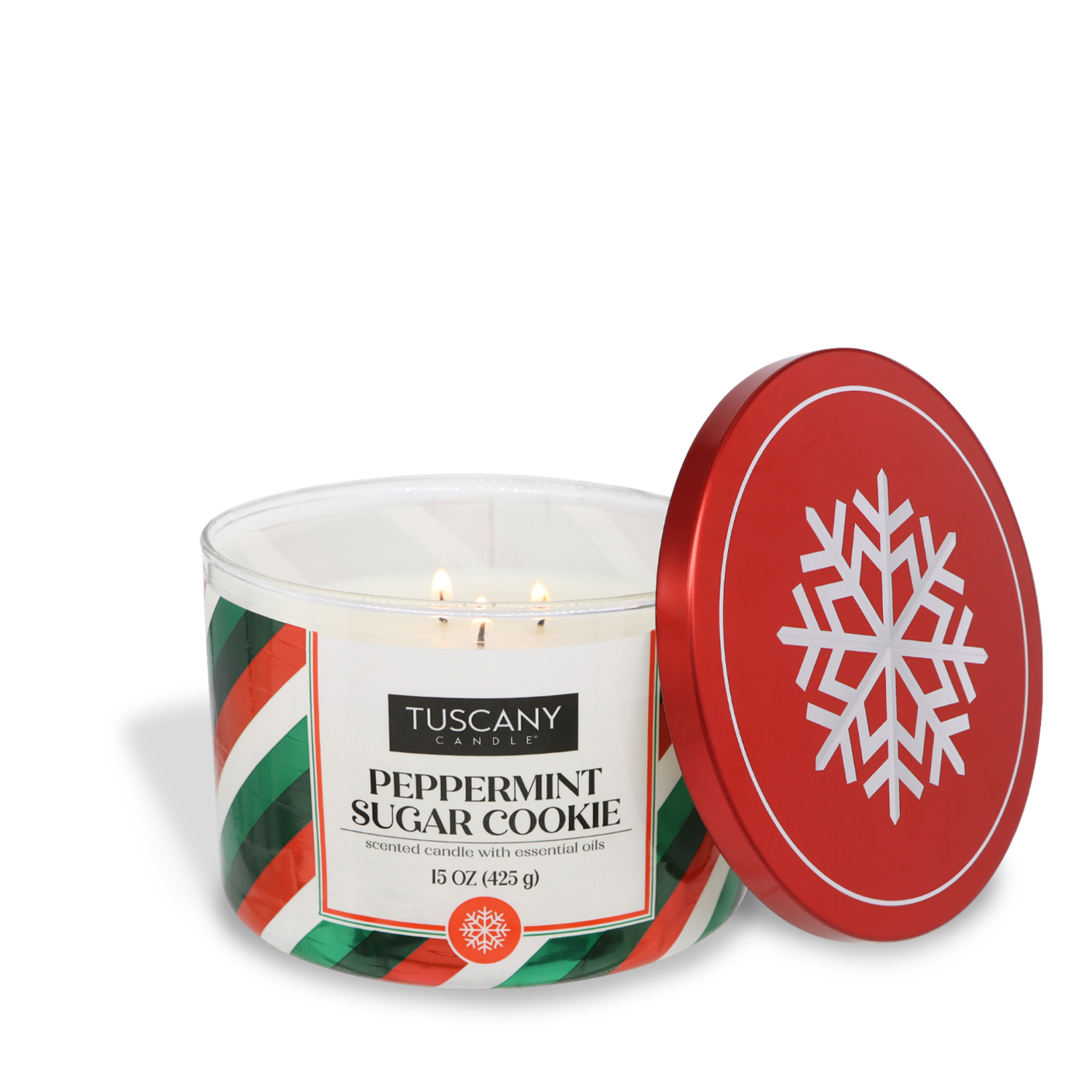 A 15 oz Peppermint Sugar Cookie Scented Jar Candle by Tuscany Candle® SEASONAL, featuring three wicks, red, green, and white striped colors, and a removable red lid adorned with a white snowflake design.