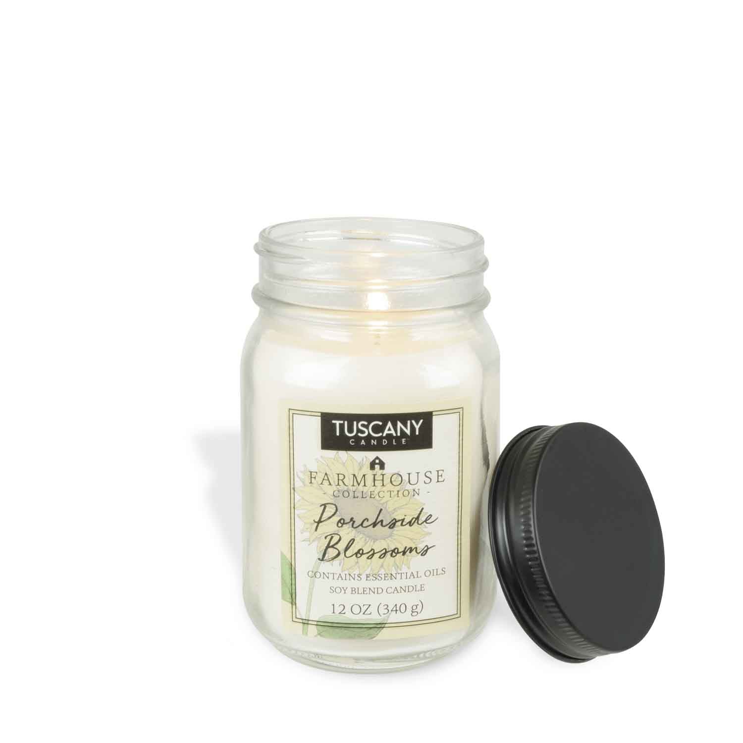A Porchside Blossoms Scented Jar Candle (12 oz) from the Tuscany Candle® EVD Farmhouse Collection.