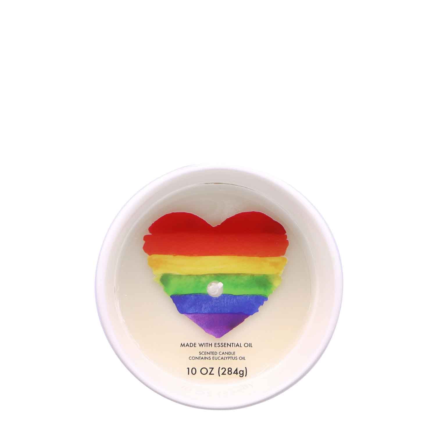 Introducing the Rainbow Heart Scented Ceramic Candle (10 oz) - Pride Collection from Tuscany Candle® SEASONAL - a heart-shaped candle featuring a mesmerizing rainbow heart design and infused with the refreshing scent of eucalyptus fragrance.