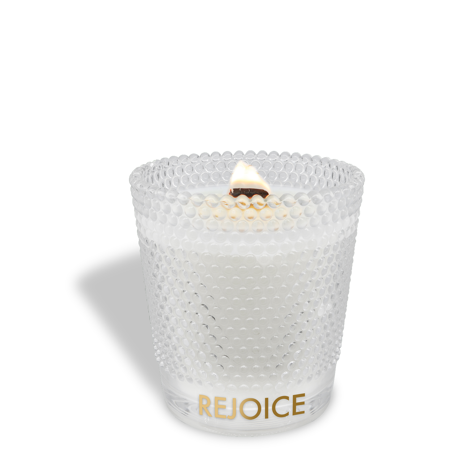 A lit Tuscany Candle® SEASONAL "Rejoice: Peppermint & Vanilla Scented Holiday Wooden Wick Candle" (13 oz) glows in a textured glass holder, with "REJOICE" in gold letters near the base.
