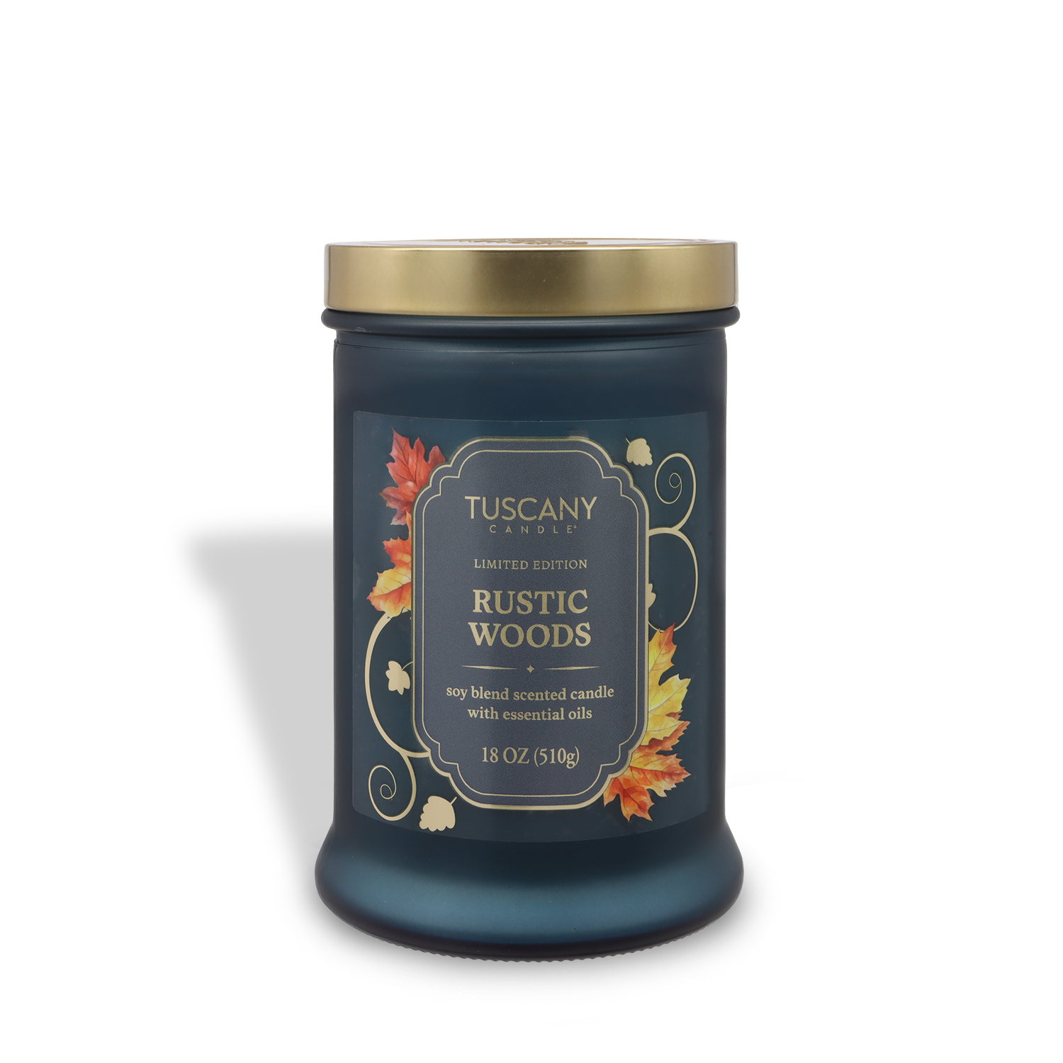 A dark green 18 oz glass jar candle by Tuscany Candle® SEASONAL, labeled "Rustic Woods: Sandalwood & Vanilla," features autumn leaves, a gold lid, and a soy blend with essential oils for a fall-inspired scent.