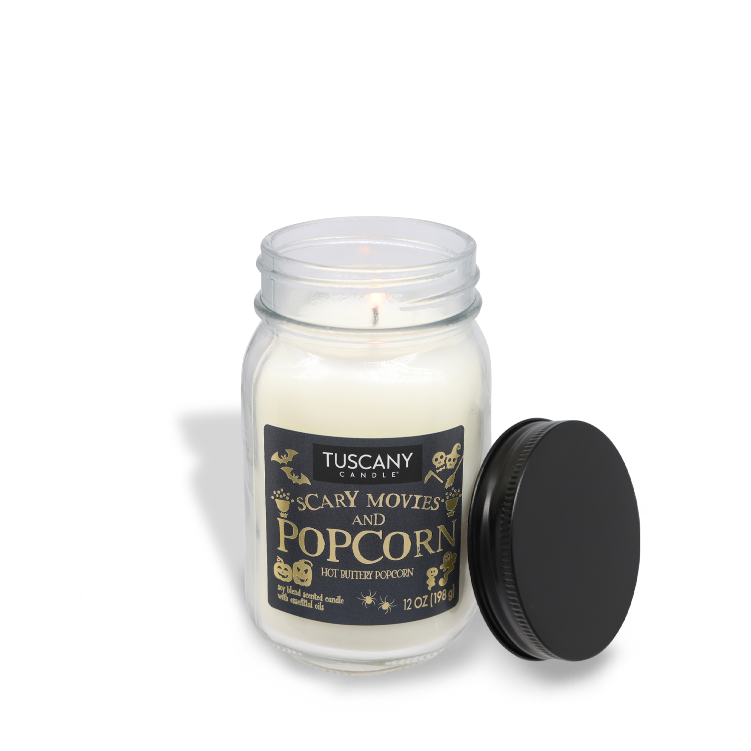 A lit candle labeled "Scary Movies & Popcorn Long-Lasting Scented Jar Candle (12 oz)" by Tuscany Candle® SEASONAL in a mason jar with the lid off, featuring premium satin wax for a smoother burn.