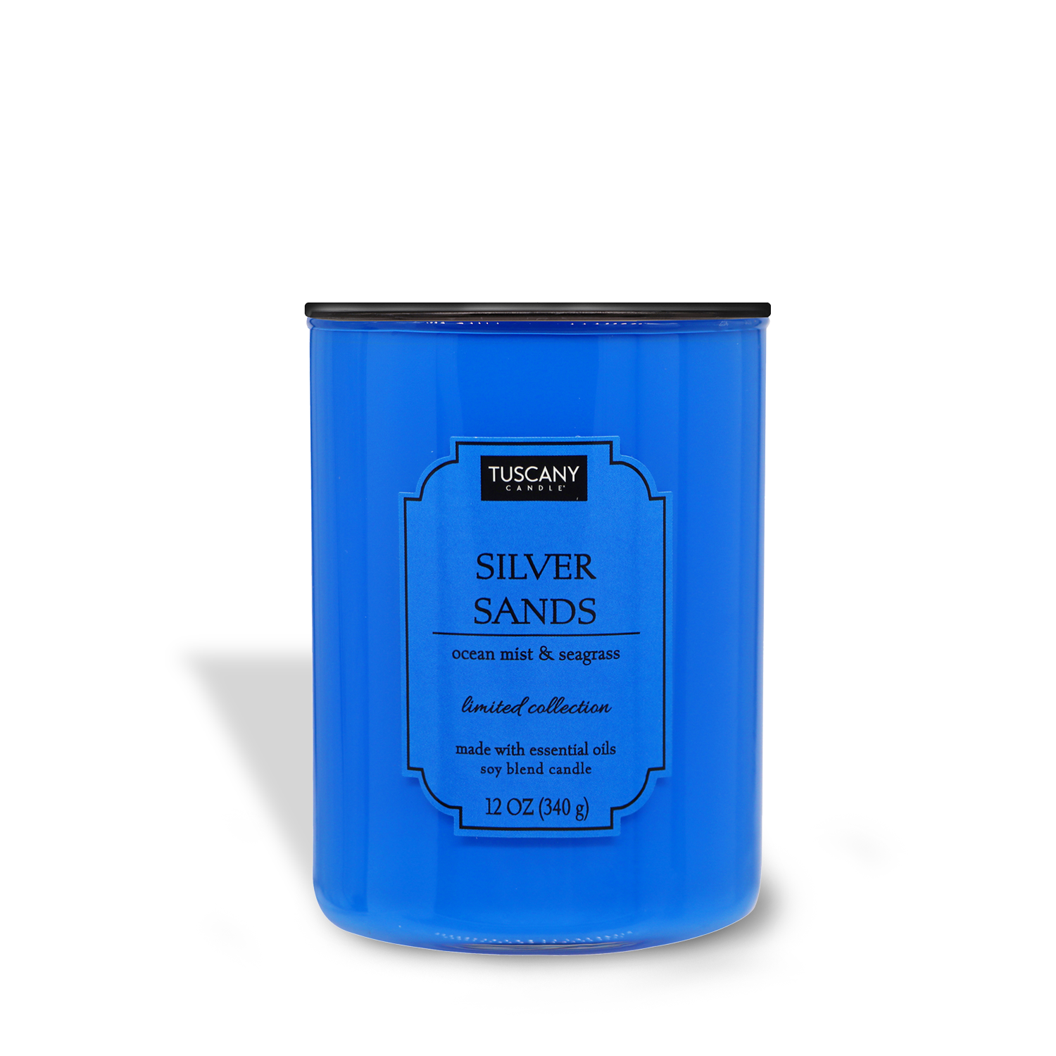 Blue Silver Sands candle in a cylindrical container labeled "Silver Sands (12 oz) – Colorsplash Collection" with ocean mist & seagrass scent description by Tuscany Candle® EVD.