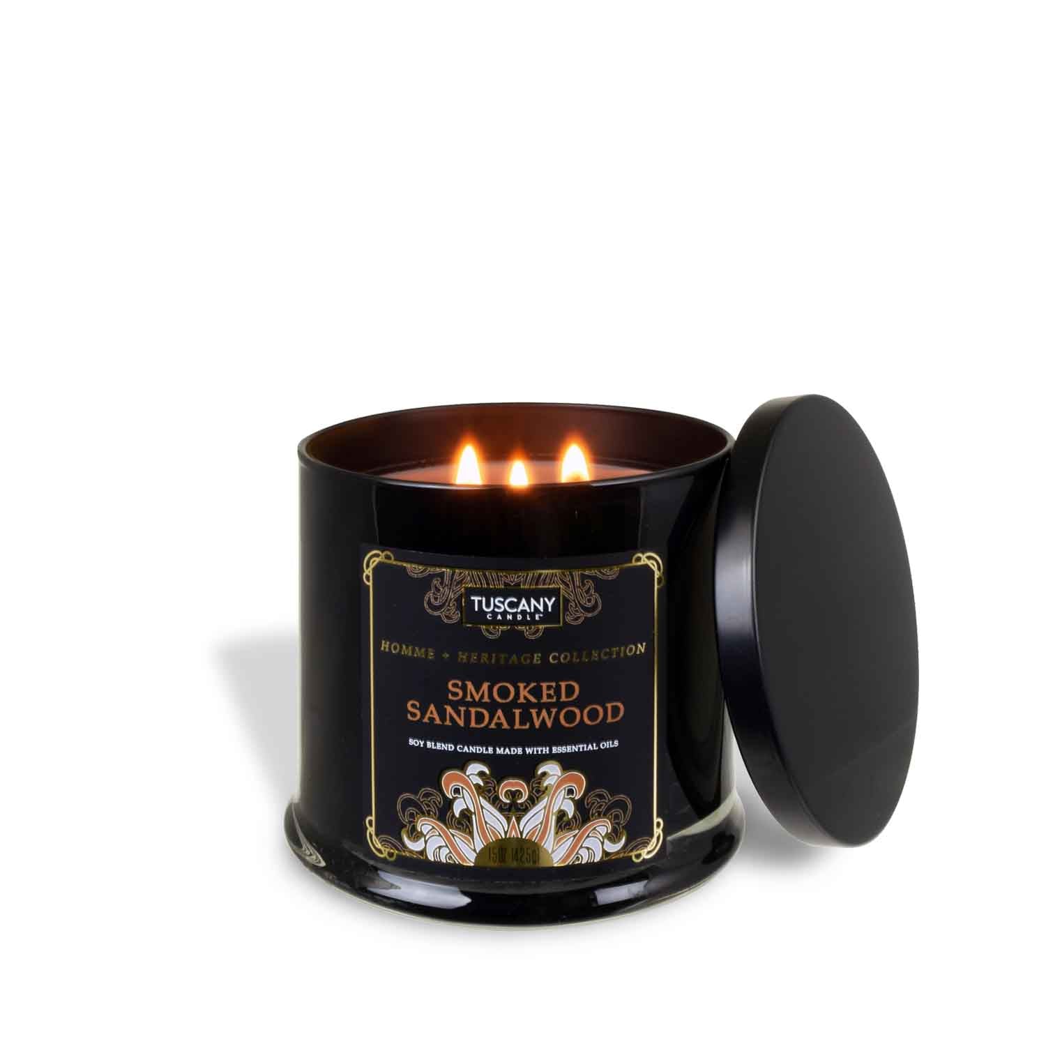 A Smoked Sandalwood scented candle in a black tin on a white background, featuring the captivating aroma of Homme + Heritage Collection from Tuscany Candle.