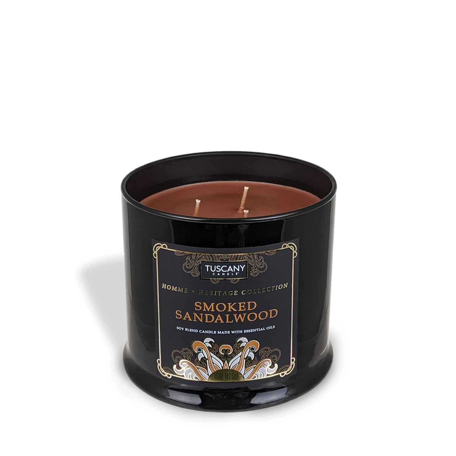 A Tuscany Candle Smoked Sandalwood scented jar candle (15 oz), from their Homme + Heritage Collection, in a black tin, resting on a white background.