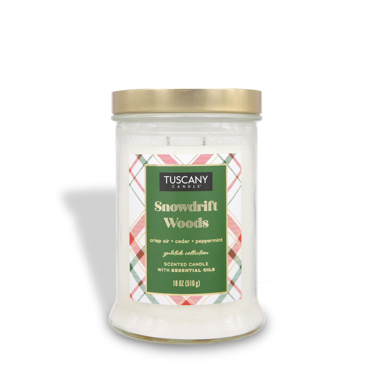 A glass jar candle labeled "Snowdrift Woods" by Tuscany Candle® SEASONAL, featuring scents that evoke crisp air, cedar, and peppermint. This 18 oz (510 g) candle is part of the "Winter Flannels Collection.