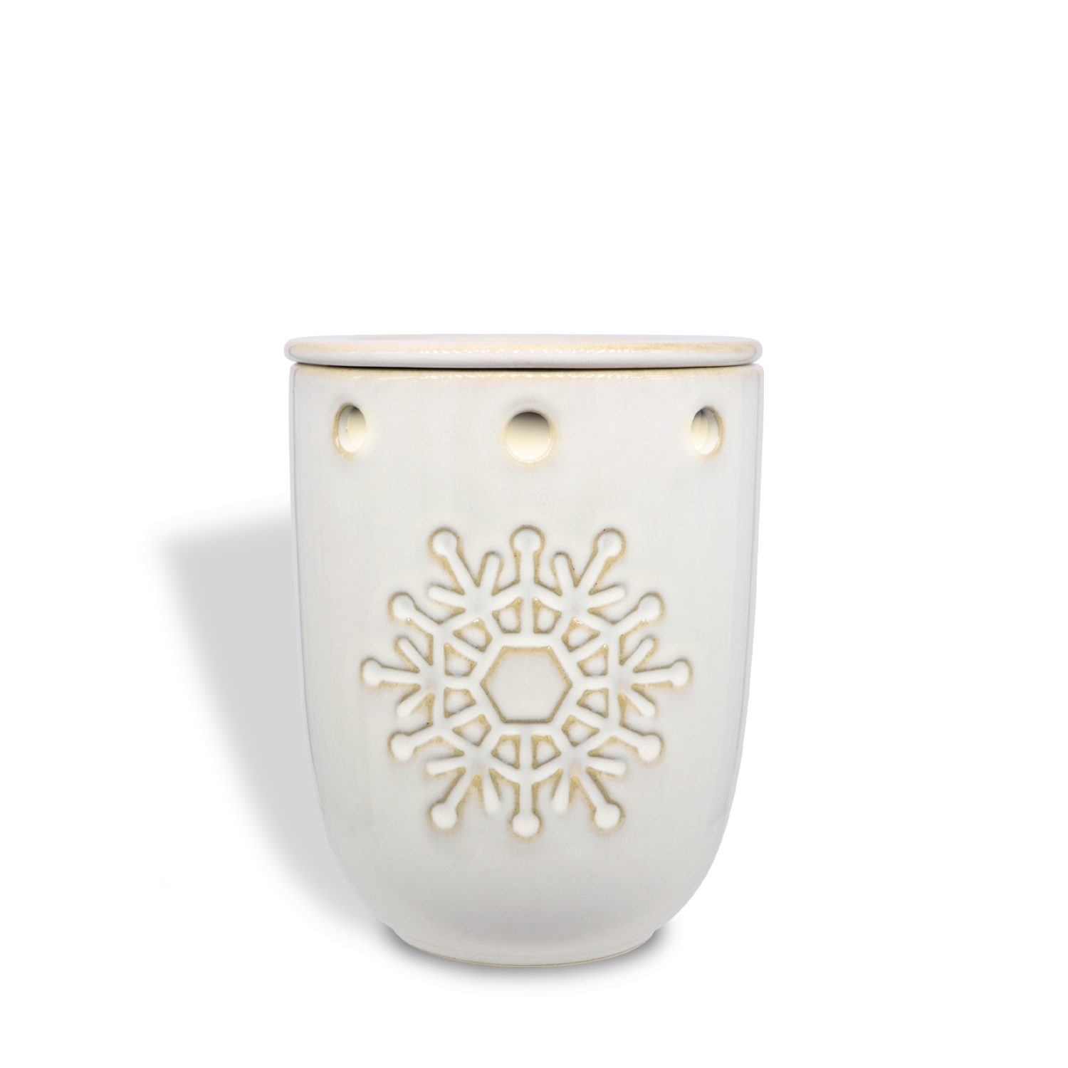 Tuscany Candle® SEASONAL's Snowflake Wax Melt Warmer is a white ceramic piece featuring a circular snowflake design with small round cutouts near the rim.