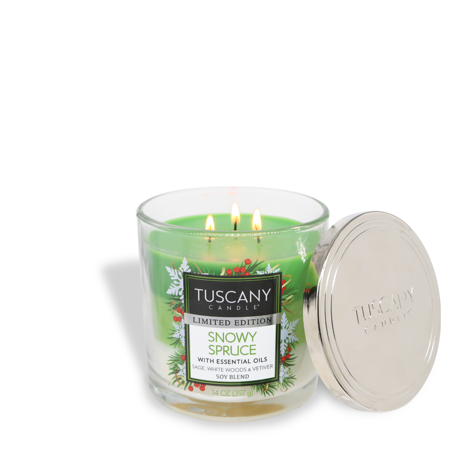 A 14 oz Tuscany Candle® SEASONAL titled "Snowy Spruce," burns with three wicks. The candle, housed in a clear glass jar with a silver lid set aside, features a label that highlights essential oils and festive holiday graphics.