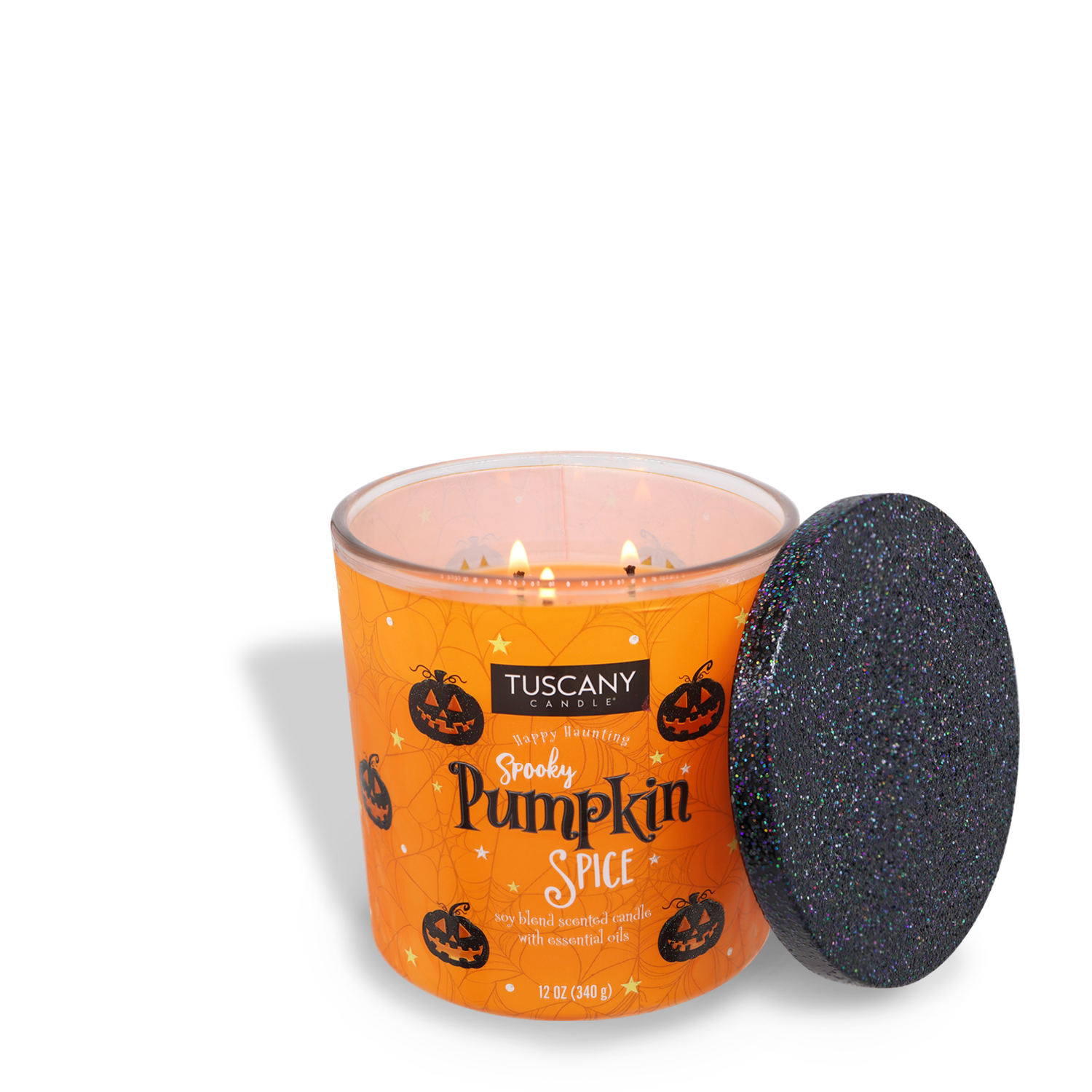 An orange candle labeled "Tuscany Candle® SEASONAL, Spooky Pumpkin Spice Long-Lasting Scented Jar Candle (12 oz)" with Halloween-themed decorations and a black glittery lid placed beside it. This scented jar candle is crafted with premium satin wax and features three wicks for an even, mesmerizing burn.