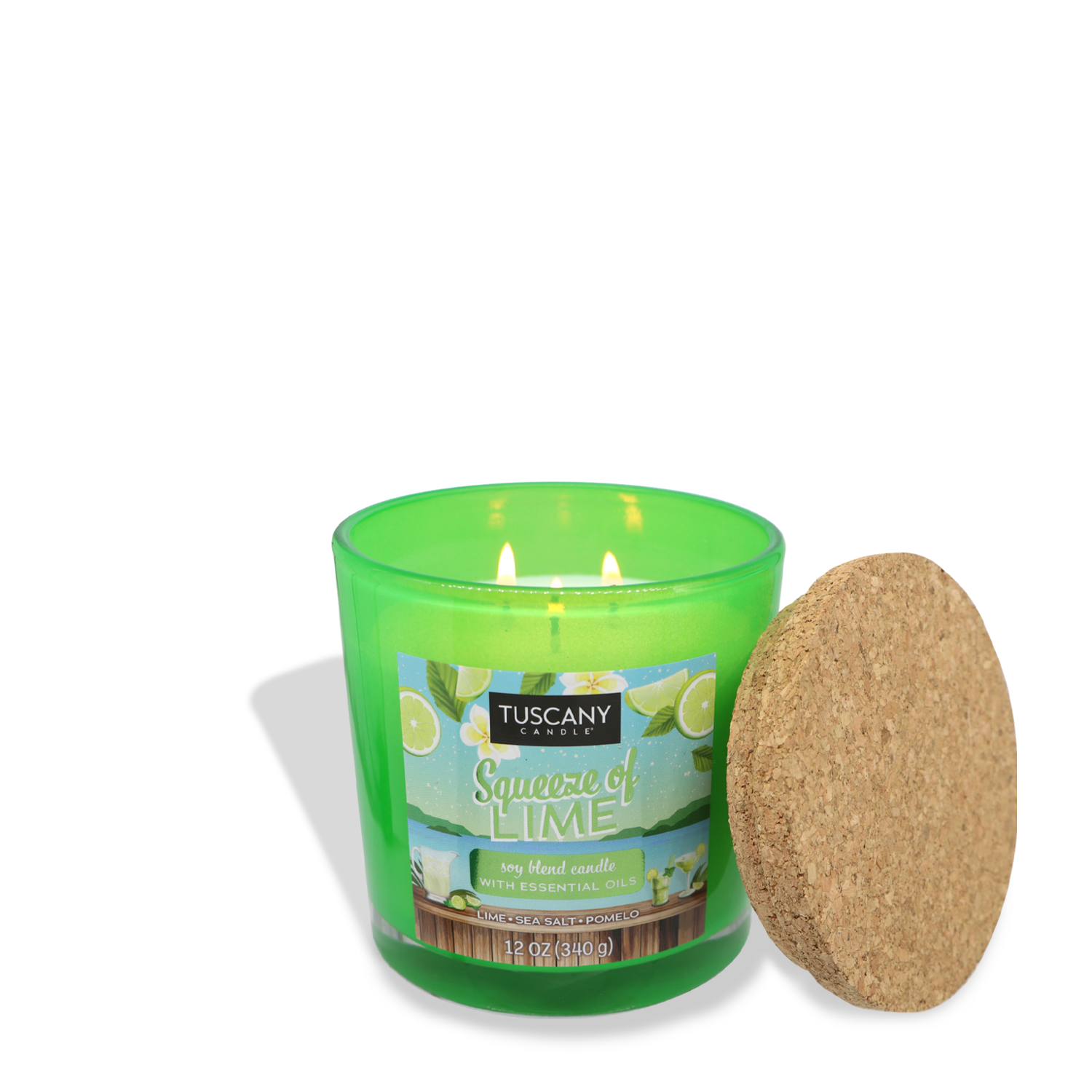 A green scented candle labeled "Squeeze of Lime (12 oz) – Sunset Beach Bar Collection" from Tuscany Candle® SEASONAL with essential oils has a cork lid placed beside it. Lit with two flames, the candle exudes a refreshing coastal fragrance, reminiscent of sea-salted pomelo and zesty lime.