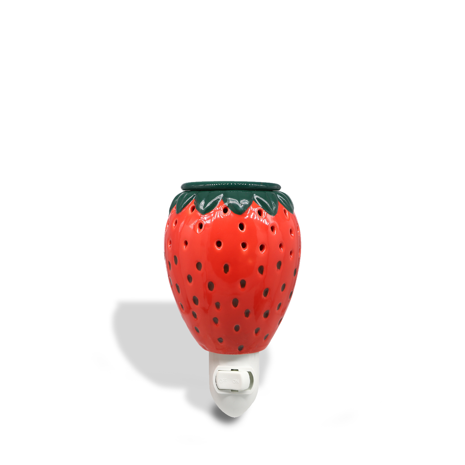 A Tuscany Candle® SEASONAL Strawberry Outlet Wax Melt Warmer plugged into a white electrical socket against a plain background.