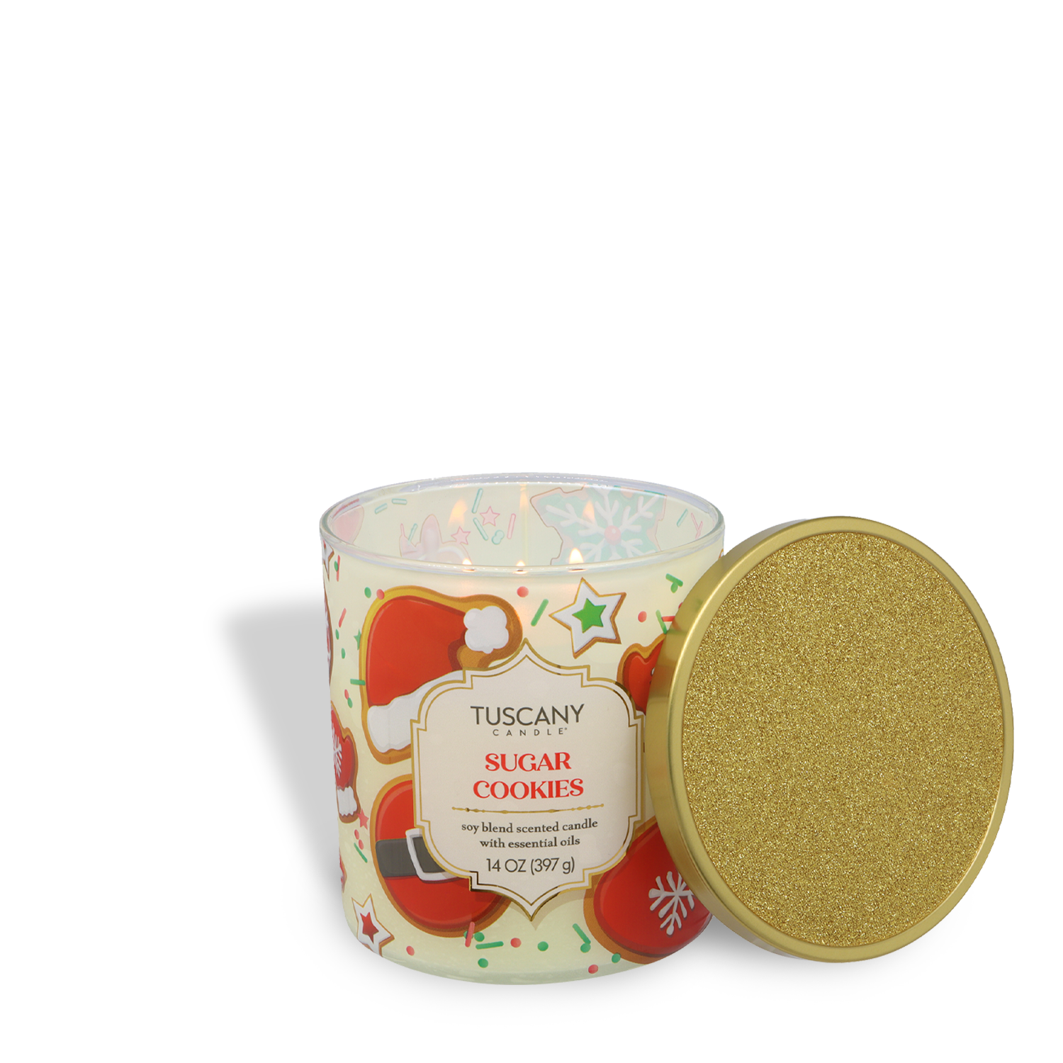 A 14 oz Tuscany Candle® SEASONAL "Sugar Cookies: Buttercream Frosted Cookie" scented Holiday Candle from the Traditions Collection, featuring a gold glitter lid and festive holiday designs, sits on a white background.