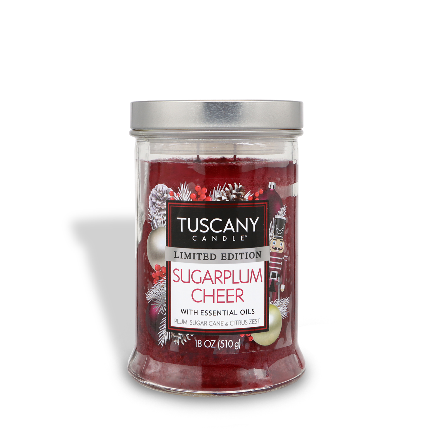 A Tuscany Candle® SEASONAL limited edition jar candle labeled "Sugarplum Cheer" with essential oils, featuring plum sugar cane and citrus zest. The 18 oz (510 g) candle has festive red colored wax.