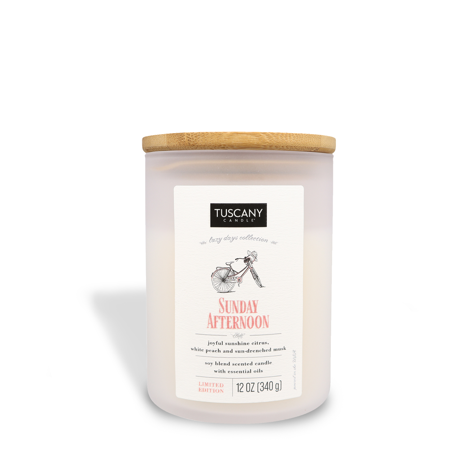 A scented candle from Tuscany Candle® SEASONAL with Sunday Afternoon fragrance in a 12 oz jar, labeled as a limited edition.
