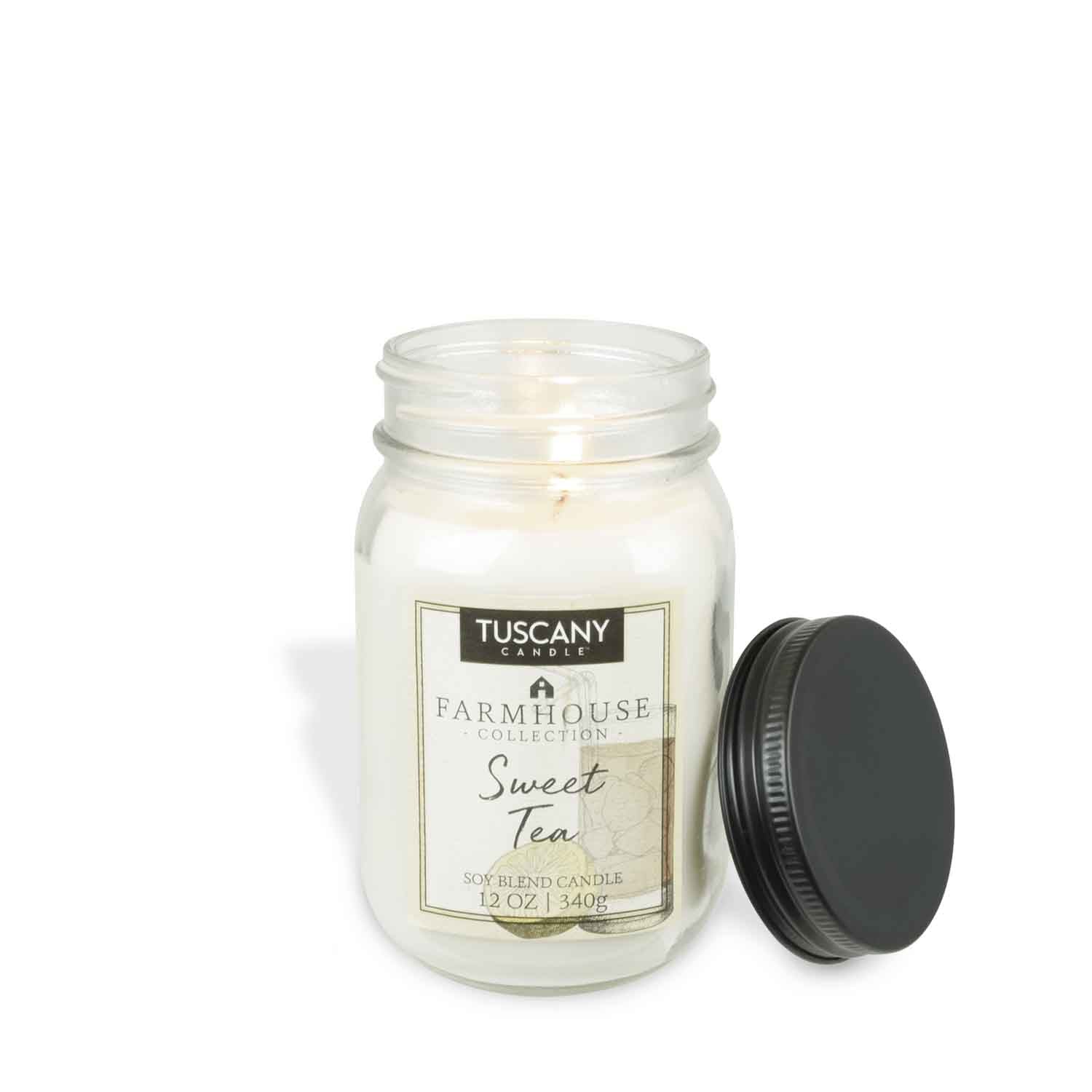 12oz 'Sweet Tea' scented candle in a clear mason jar with a black lid, radiating rustic farmhouse elegance and the heartwarming scent of black tea, sugar, and lemon.