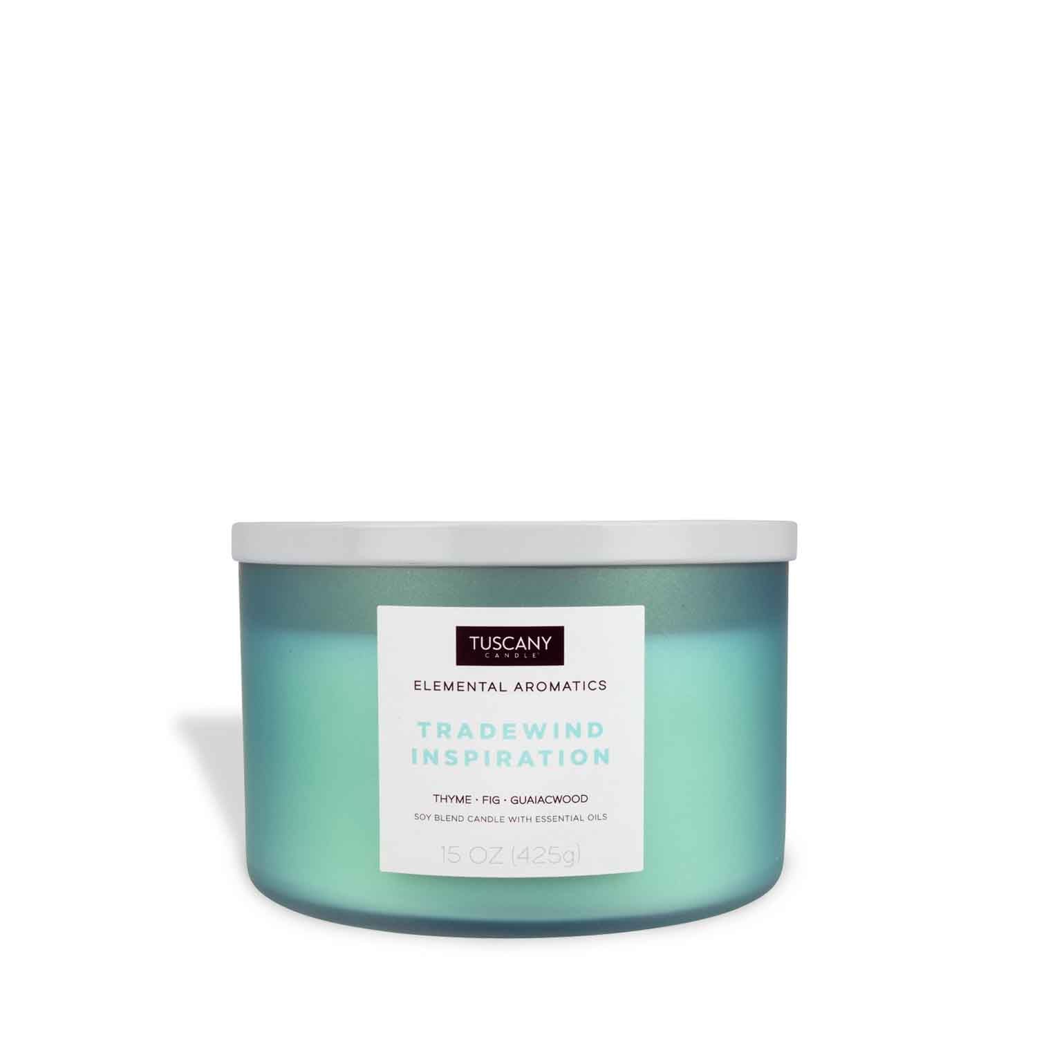 A Tradewind Inspiration scented candle in a tin with a green lid by Tuscany Candle® EVD.