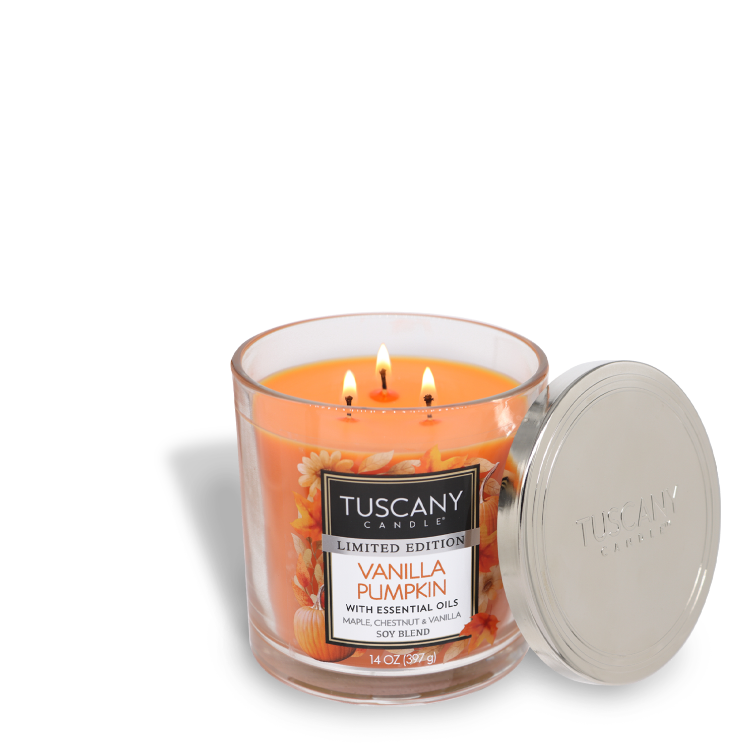 A lit Tuscany Candle® SEASONAL in a glass jar labeled "Vanilla Pumpkin Long-Lasting Scented Jar Candle (14 oz)" with essential oils, featuring premium satin wax, three wicks, and an open silver lid beside it.