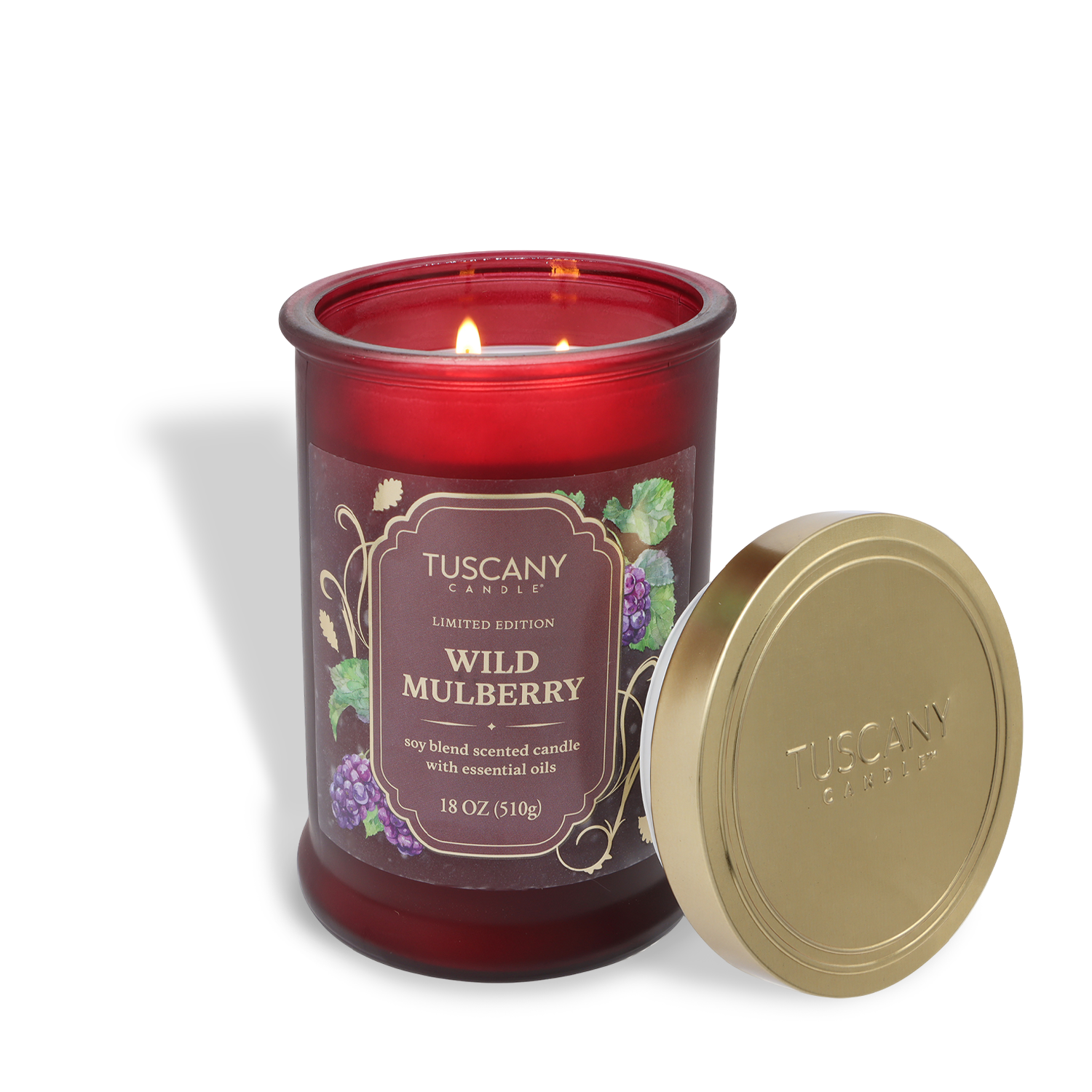 An 18 oz Tuscany Candle® SEASONAL jar in "Wild Mulberry: Tart Grapefruit & Blackberry," gold lid off, features two lit wicks; a soy blend fall-scented candle.