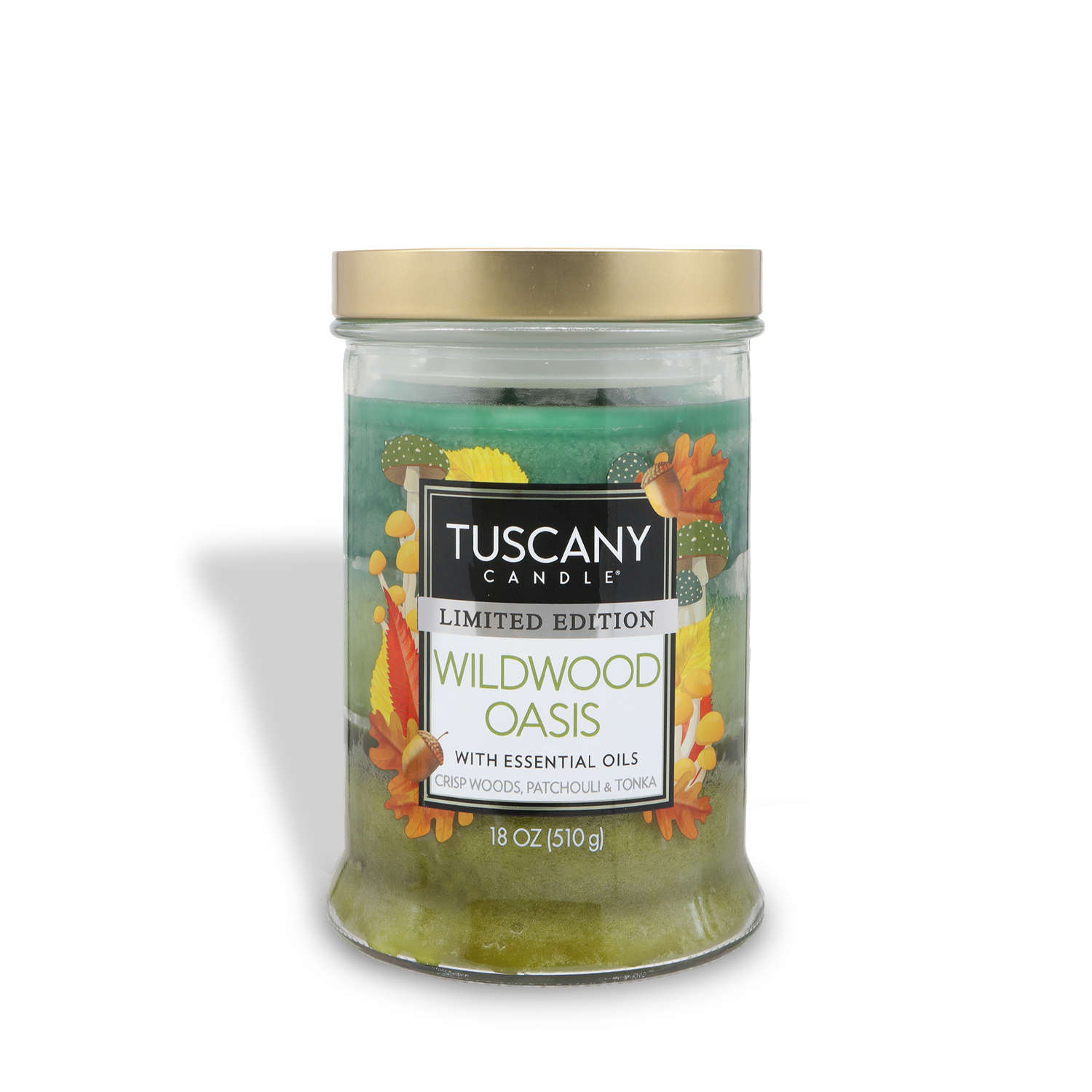 An 18 oz Tuscany Candle® SEASONAL Wildwood Oasis: Amber Woods & Patchouli scented fall candle in a glass jar with a gold lid, featuring leaf accents and scent descriptions on the label.