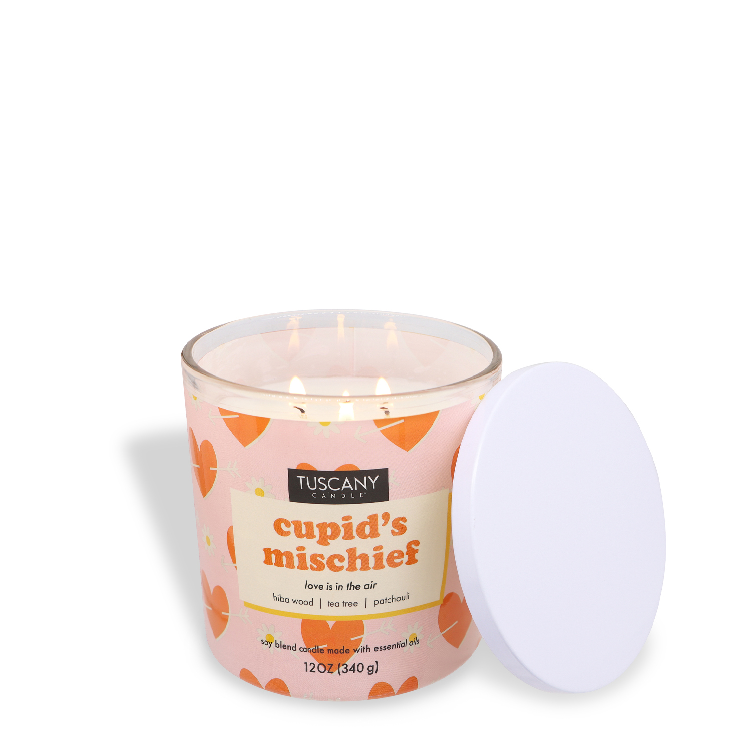 The Tuscany Candle® SEASONAL's 12 oz "Cupid's Mischief: Patchouli Scented Valentine’s Day Candle" envelops the room with alluring tones of hibiscus, wood, tea, and patchouli. This special Valentine's Day candle is tastefully showcased with its white lid beside the flickering flame.