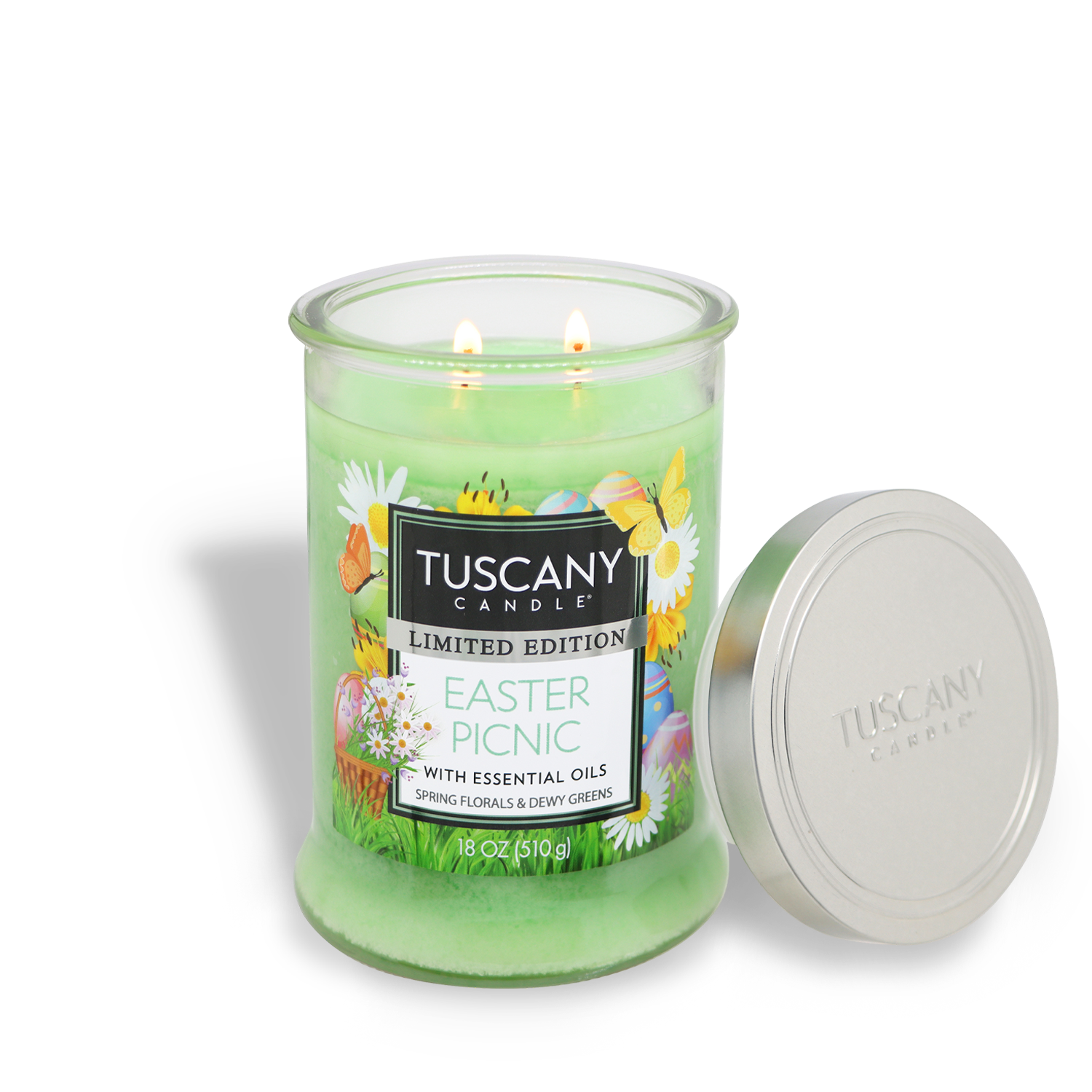 A green 18 oz peony scented candle by Tuscany Candle® SEASONAL, labeled "Easter Picnic," sits in a glass jar with a silver lid beside it.