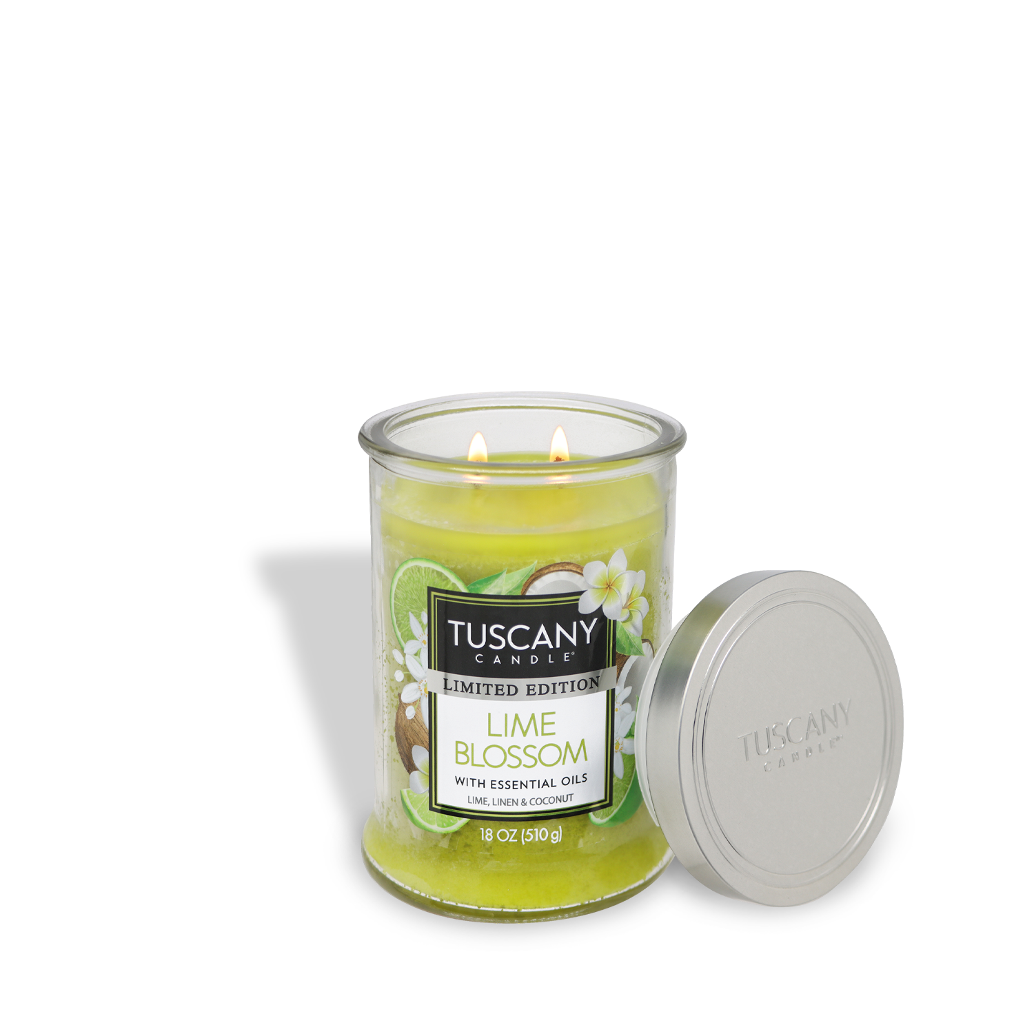 The 18 oz Lime Blossom candle from Tuscany Candle® SEASONAL features a linen scent, essential oils, and a lit double wick in a green glass jar, with a silver lid beside it.