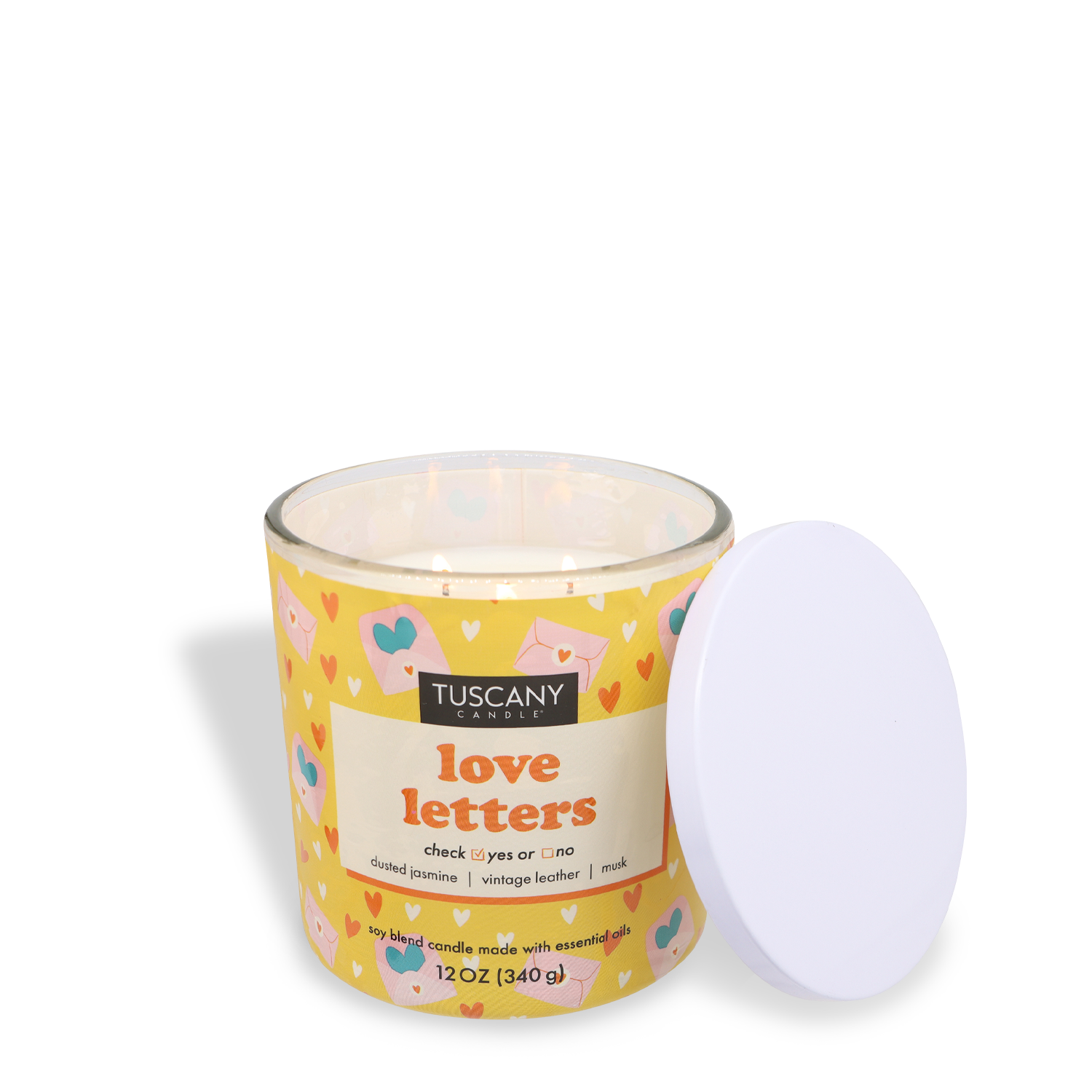 The "Love Letters" candle by Tuscany Candle® SEASONAL, featuring a heart pattern and an enticing jasmine and leather scent, is elegantly presented in yellow with an open white lid.