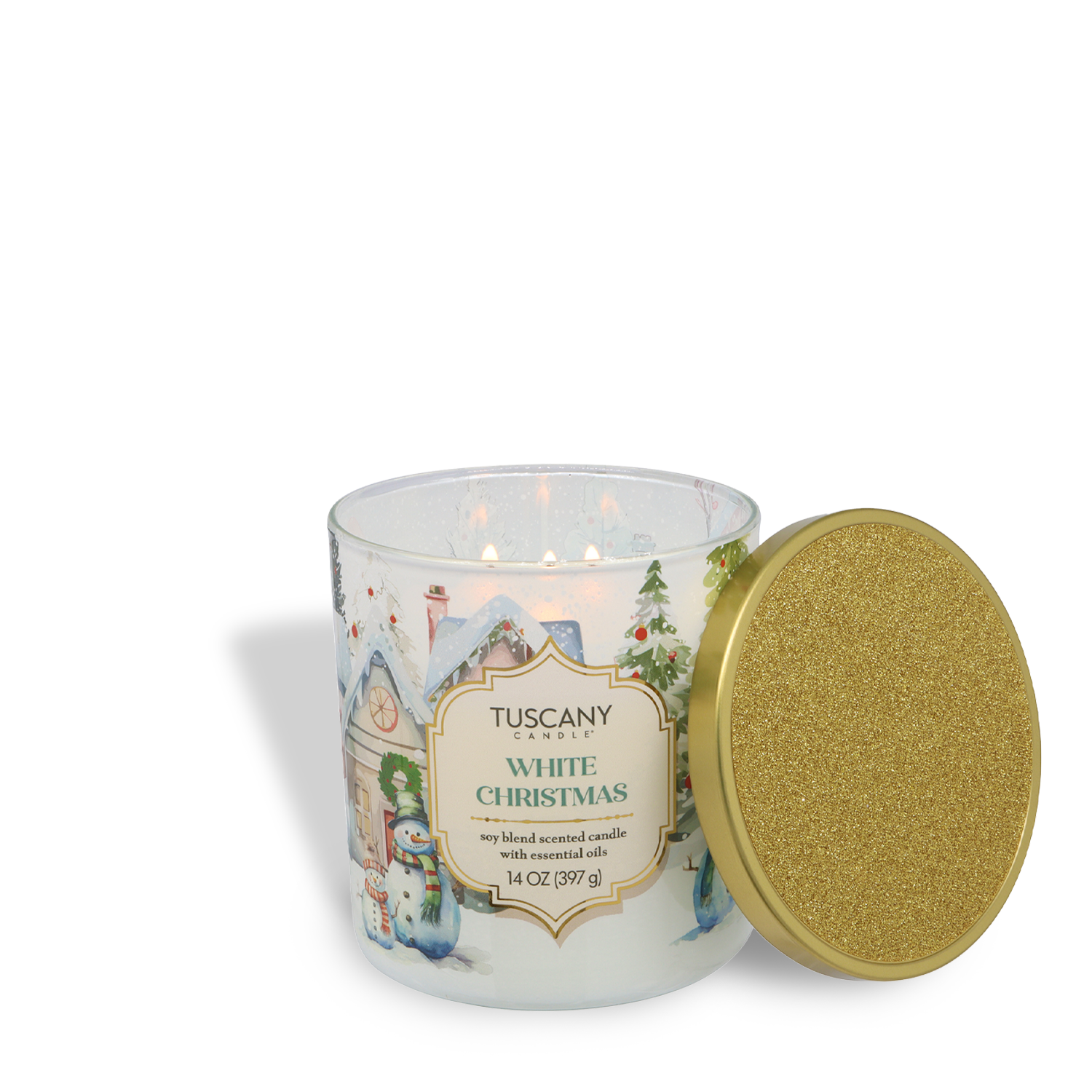 A lit Tuscany Candle® SEASONAL "White Christmas: Fresh Snow & Soft Woods" (14 oz) from the Traditions Collection in a holiday-themed glass jar, beside a gold glittered lid.