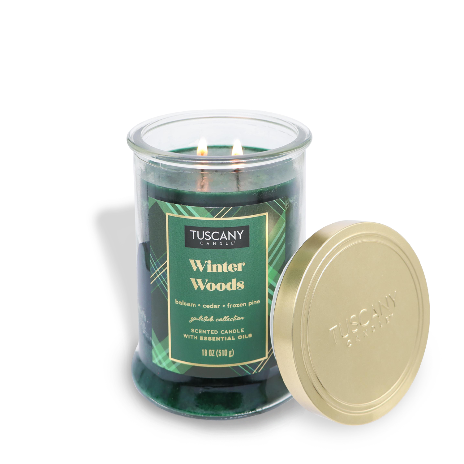 An 18 oz green "Winter Woods" scented jar candle, part of the Winter Flannels Collection by Tuscany Candle® SEASONAL, in a glass jar with a gold lid, features notes of balsam, cedar, and frozen pine.