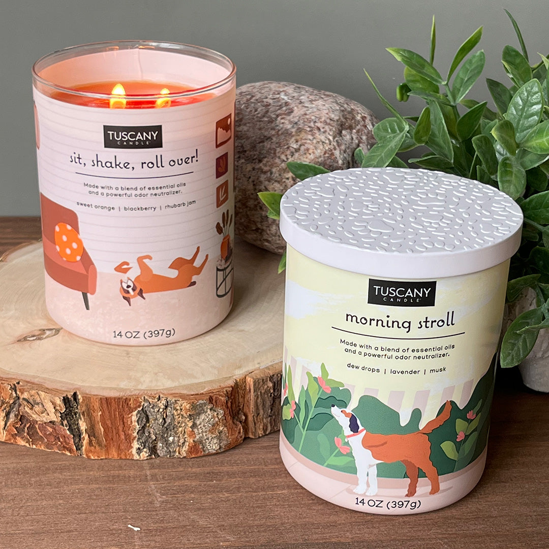 Two Morning Stroll Scented Jar Candles (14 oz), from the Tuscany Candle Pet Odor Control Collection, emitting delightful fragrance, placed next to each other.