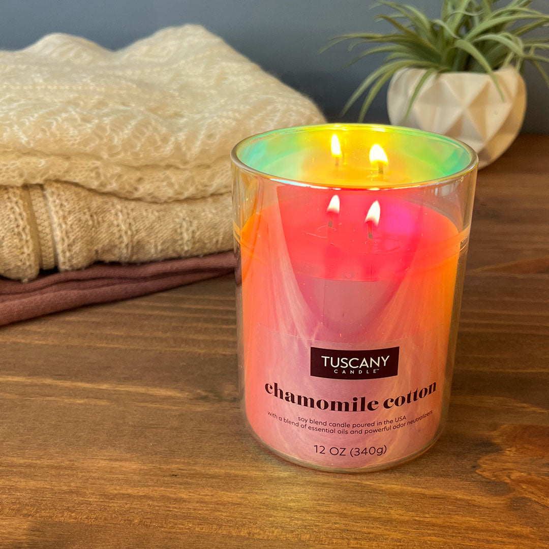A still life with Chamomile Cotton, an odor eliminating scented candle from Tuscany Candle's Serene Clean® collection of scented candles and wax melt bars
