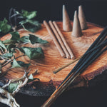 Load image into Gallery viewer, A variety of incenses are shown in a still life photo - these items form the core for the fragrance notes in the &quot;Oakmoss and Incense&quot; scented candle from Tuscany Candle&#39;s &quot;Home &amp; Heritage&quot; collection of masculine candles.
