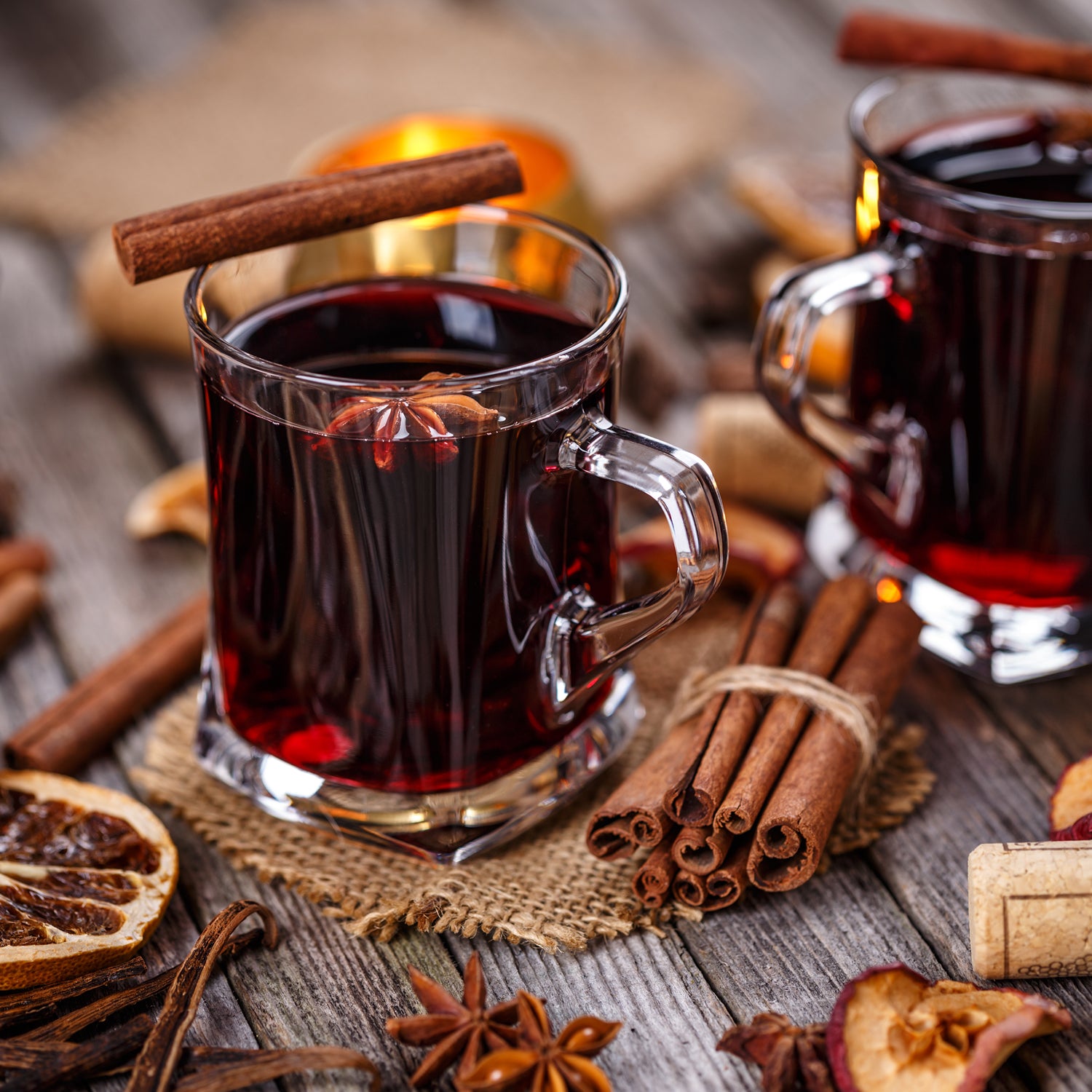 A still life photo of nutmeg and other warm spices, - this gentle fragrance are some of the key notes in "Spiced Casmere", a unisex scented candle from Tuscany Candle's "Homme & Heritage" collection of scented candles