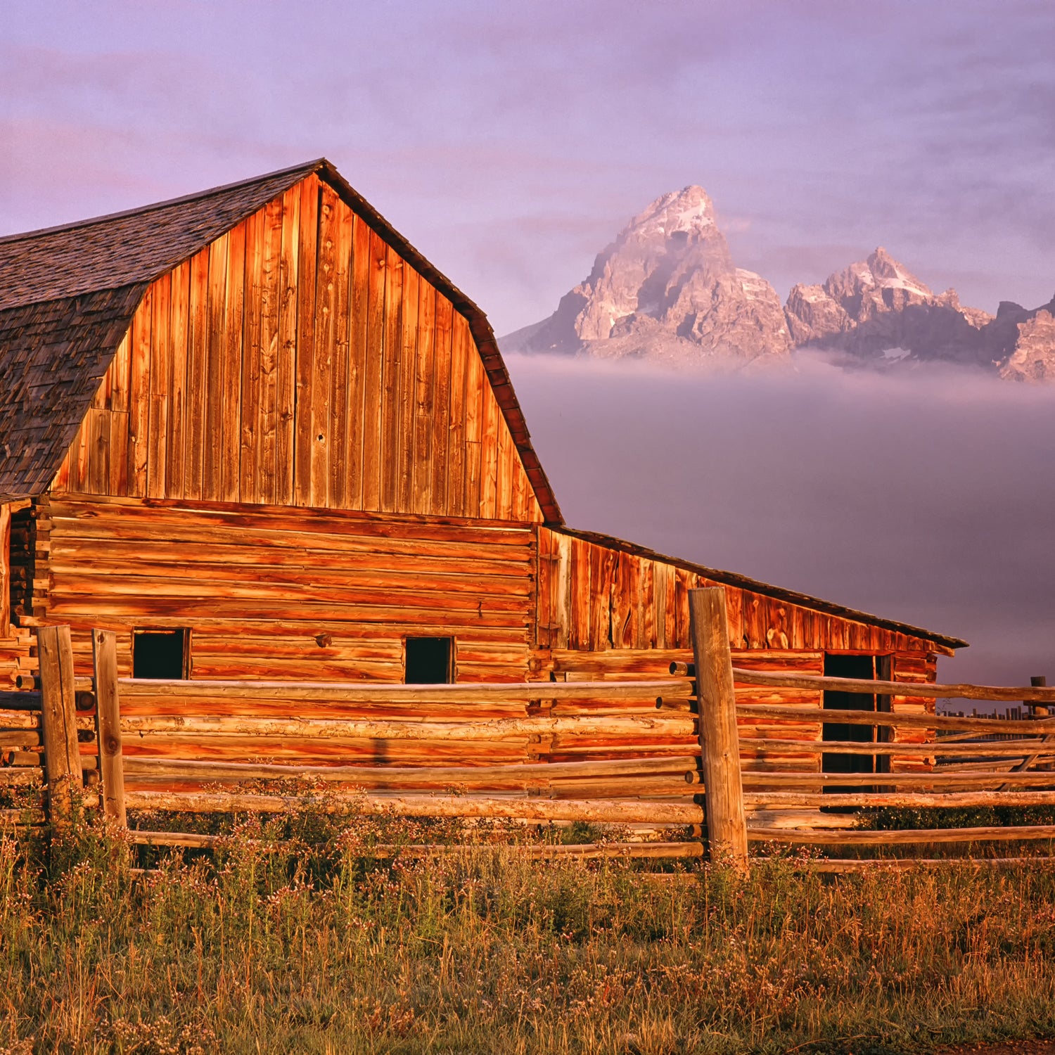 An old rustic barn at sunset in the high prairie.  Scenes such as this are part of the inspiration for our "Weathered wood" scented candle